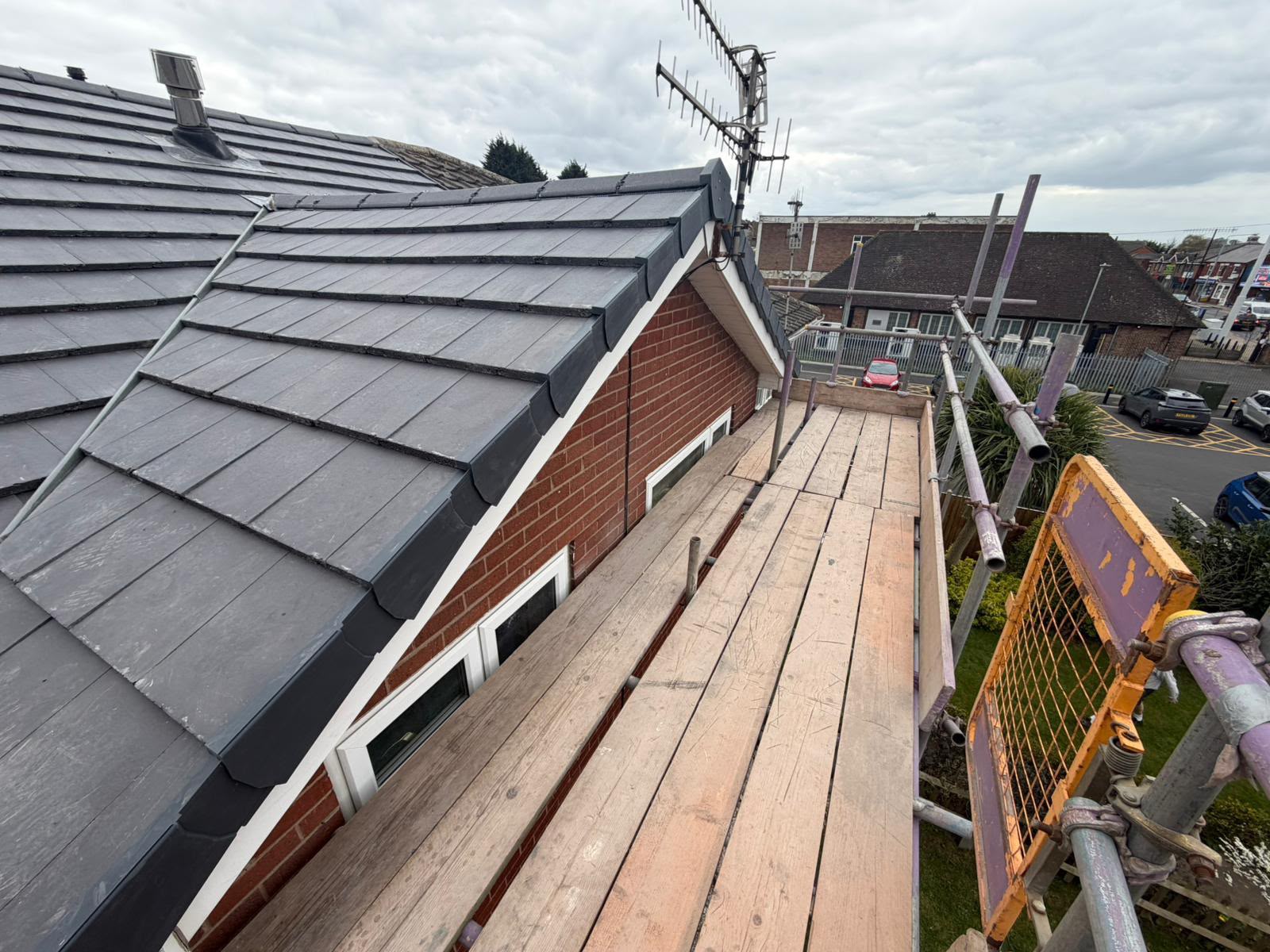 Freshly installed slate roof with lead flashing on a Sussex property